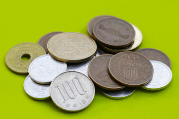 Japan money, Coins on green background.