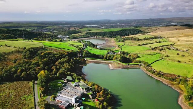 Cinematic, aerial clip of Ogden Reservoir, Oldham, on the edge of the Pennines.