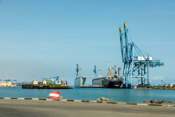 Djibouti city port cargo terminal with cranes, floating docks and ships, Djibouti