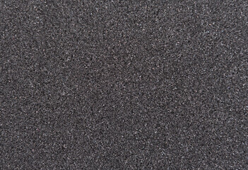 Background filled with black particles.