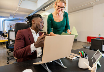 Office colleagues working together on a project