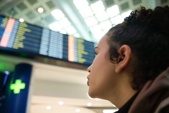Woman checking flight information at airport