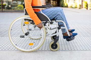 Close-up shot of a black woman in a wheelchair