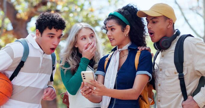 Friends, talking and surprise for phone in park, conversation and online for gossip in post and social media. Gen z, men and women in nature, watch and outdoor for shock in video, wow and students