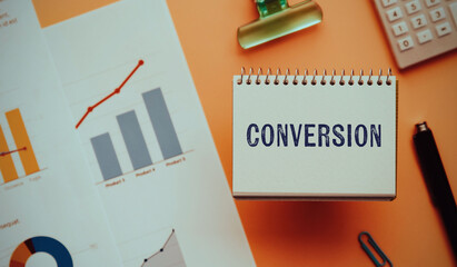 There is notebook with the word Conversion. It is as an eye-catching image.