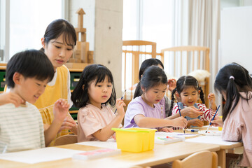 Teachers and students studying with school children and after-school day care services Multiple elementary school students