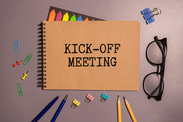 KICK-OFF MEETING text on paper folder with pen. Business concept