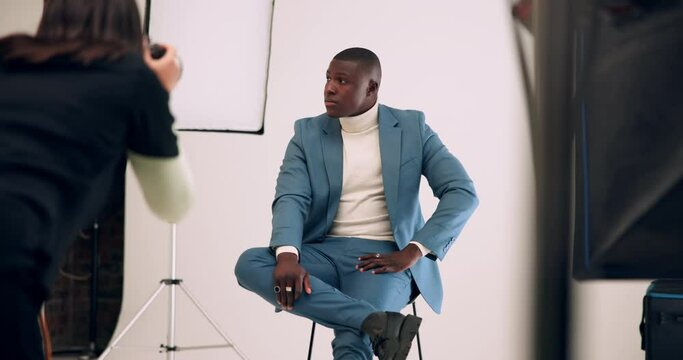 Photographer, camera and photoshoot in studio of businessman for corporate fashion, production and seo company. People, photography and black man posing on white background, shooting and professional