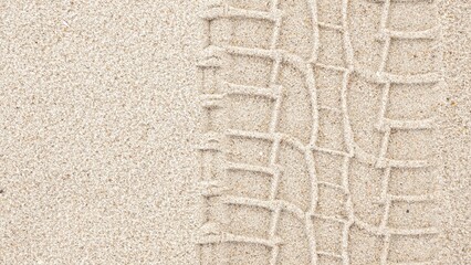 Detailed View of a Tire Track Left on a Sandy Beach Shoreline, Nature Transportation Adventure Scene