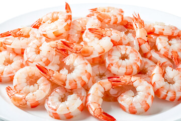 Close up of cooked shrimp on white plate