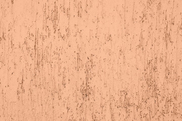Peach fuzz textured surface, closeup. Trendy shade of 2024 year