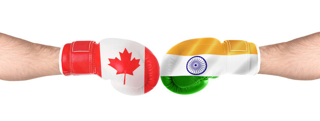 Political conflict. Men in boxing gloves with flags of Canada and India fighting on white...