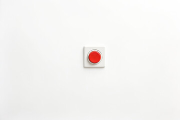 Red Button on a White Wall