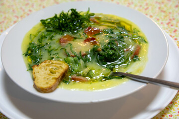 Traditional Portuguese green broth with potatoes, cabbage and chorizo ​​sausage