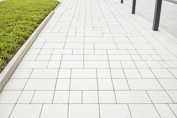 Fototapeta premium White Paver Stone Pathway With Grass Border
