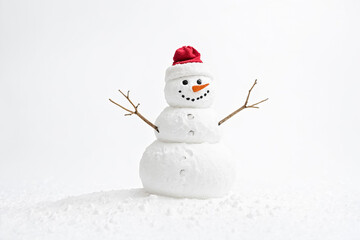 Fototapeta premium Snowman with a red Santa hat
