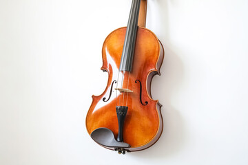 Fototapeta premium Violin Hanging on a White Wall