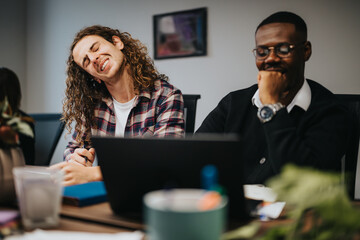 Two cheerful employees share a joyful moment during a business strategy session. Captured in a modern office setting, embodying teamwork and positivity.