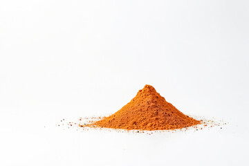 Heap of red pepper powder on white background