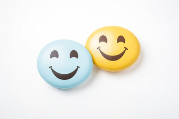 Fototapeta premium Two Smiling Emojis on White Background