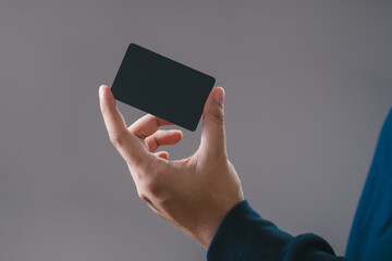 businessman is using a empty credit card  for financial transactions. Online banking purchase product on internet in home office or online shopping. Convenience in the world of technology.