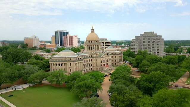 Aerial footage over Jackson, MS including Mississippi State Capitol Building