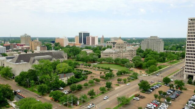 Aerial footage over Jackson, MS including Mississippi State Capitol Building