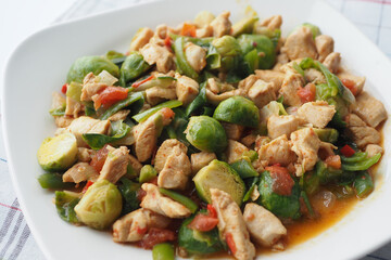 Enjoy a nutritious StirFry Brussel Sprouts with Chicken and Vegetables for a wellrounded meal