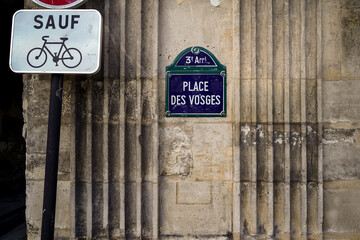 Typical vintage parisian street sign , Place des Vosges 
