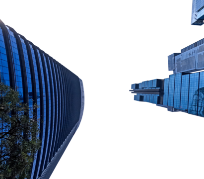 A stunning view of a skyscraper against a clear blue sky, captured from a low angle, showcasing the architectural magnificence and modern urban design.