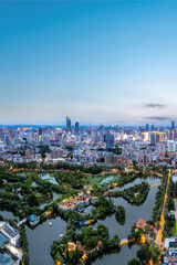 Obraz premium Scenic Urban Skyline with Verdant Parks