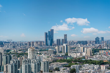 Obraz premium Modern Urban Cityscape with Skyscrapers Under Blue Sky