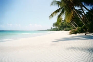 Obraz premium Close-up of soft sand on a tropical beach on a sunny day, with a blurry sea and coconut palm in the background. This idyllic scene captures the essence of a perfect holiday destination.