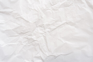 Wrinkled or crumpled white stencil or tissue paper used for crumpled paper background texture..