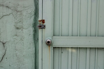 Old green door with lock
