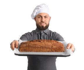Male baker holding tray with rye bread on white background