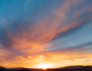 Dazzling and beautiful wide angle colorful sunset with dramatic sky and clouds in Sedona, Arizona.