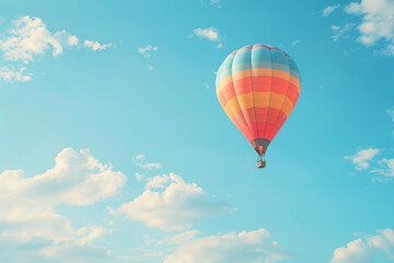 Naklejka premium colorful hot air balloon flying in the blue sky with cloud backgrounds