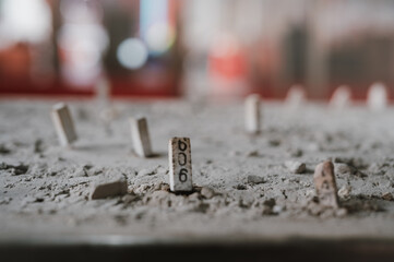 A surface from which many small rectangular objects protrude. One of these objects has the number 