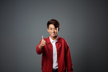 Portrait of a teenager wearing a red-white outfit on an isolated background with copy space