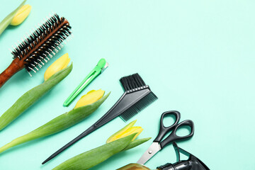 Fototapeta premium Set of hairdresser's accessories with tulips on turquoise background