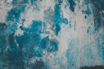 A blue and white wall with a blue sky background