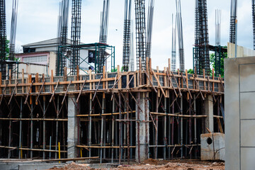 A construction site with scaffolding and a building under construction