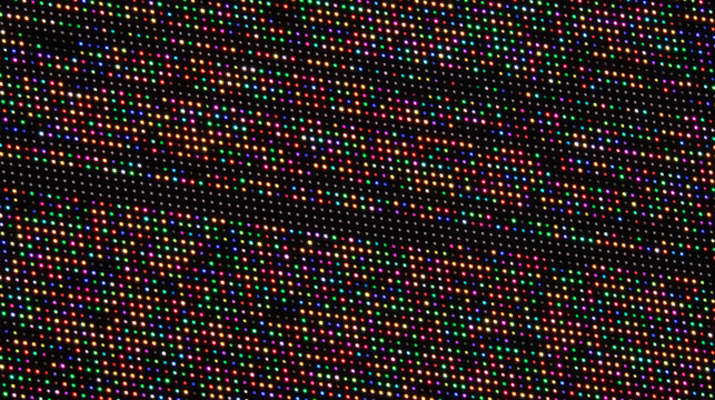 A colorful, pixelated image with a black background. The image is full of bright colors and has a vibrant, energetic feel 