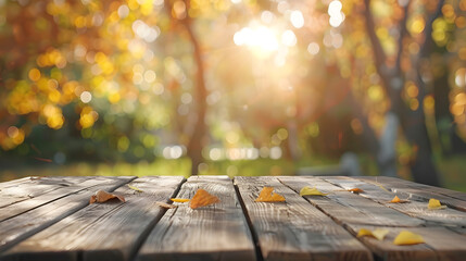 A rustic wooden table adorned with autumn leaves, set in a sunlit park with vibrant fall foliage. Ideal for themes of nature, seasons, and outdoor relaxation.