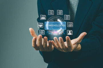 Stakeholders concept. Person touching stakeholders icon on virtual screen for business finance stakeholder investment management. Different stakeholders contact collaboration for company organization