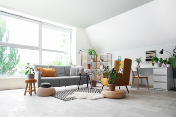 Interior of living room with sofa, armchair and witch's magic attributes on table