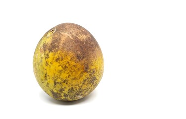 Ripe Indian Bael Fruit or Wood Apple Isolated on White Background with Copy Space, Also Known as Aegle Marmelos, Bengal Quince, Japanese Bitter Orange or Stone Apple