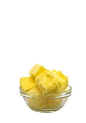 Organic Milk Butter Cubes in a Glass Bowl Isolate on White Background with Copy Space