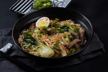 Japanese Ramen with chicken, Mushrooms, Eggs and bok choy cabbage in a bowl